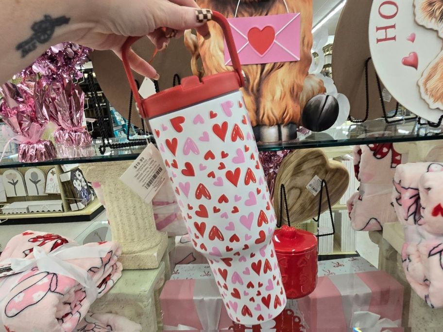 Hand holding a Valentine's Day Tumbler from Hobby Lobby