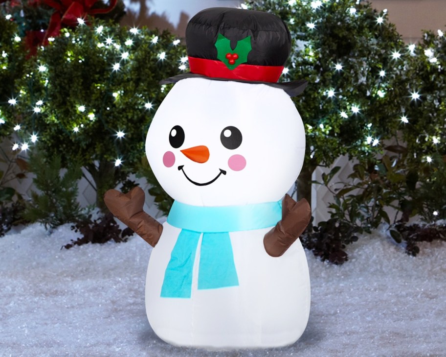 small snowman inflatable in yard