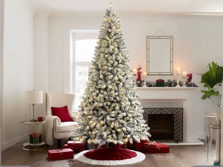 Holiday Time 9' Pre-Lit Flocked Frisco Pine Artificial Christmas Tree stock image