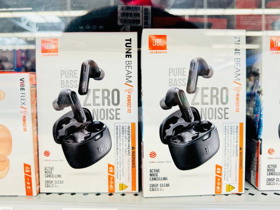 2 pair of ear buds in packaging on a store shelf