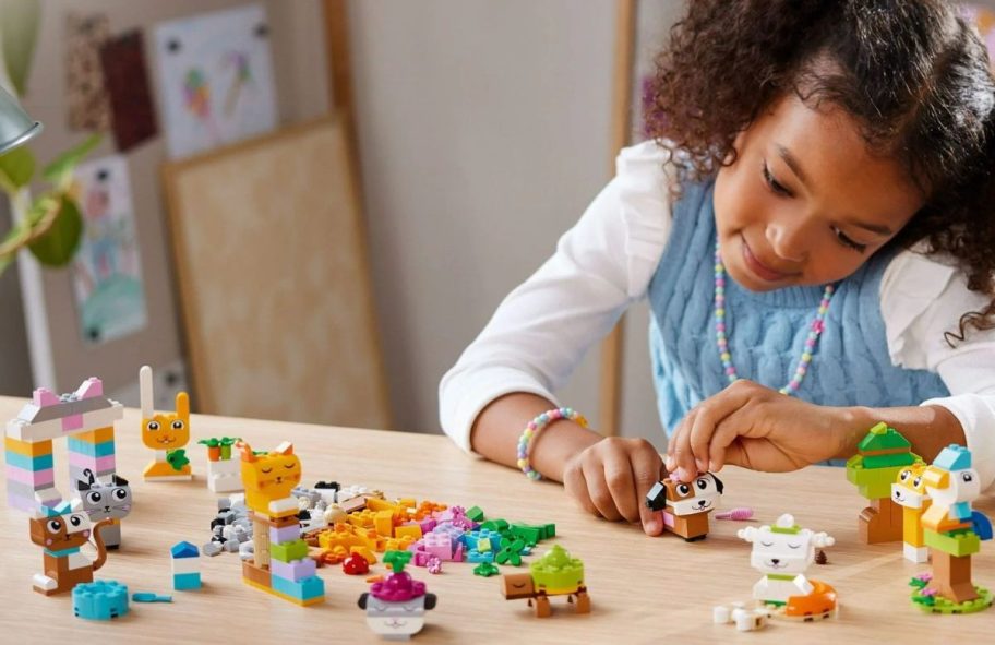 Little girl playing with LEGO Classic Creative Pets