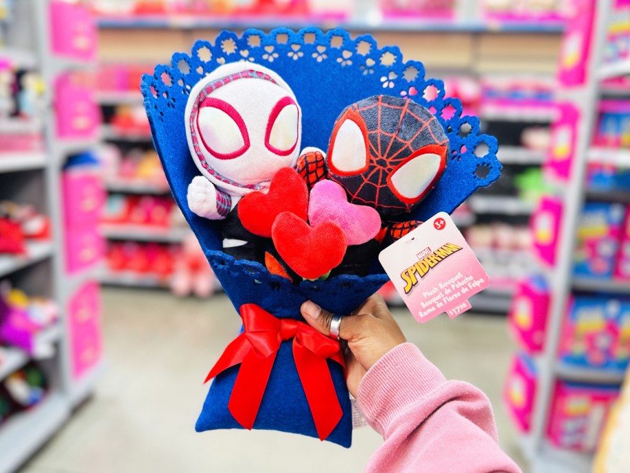 hand holding up a Marvel 14" Plush Valentine's Bouquet in store