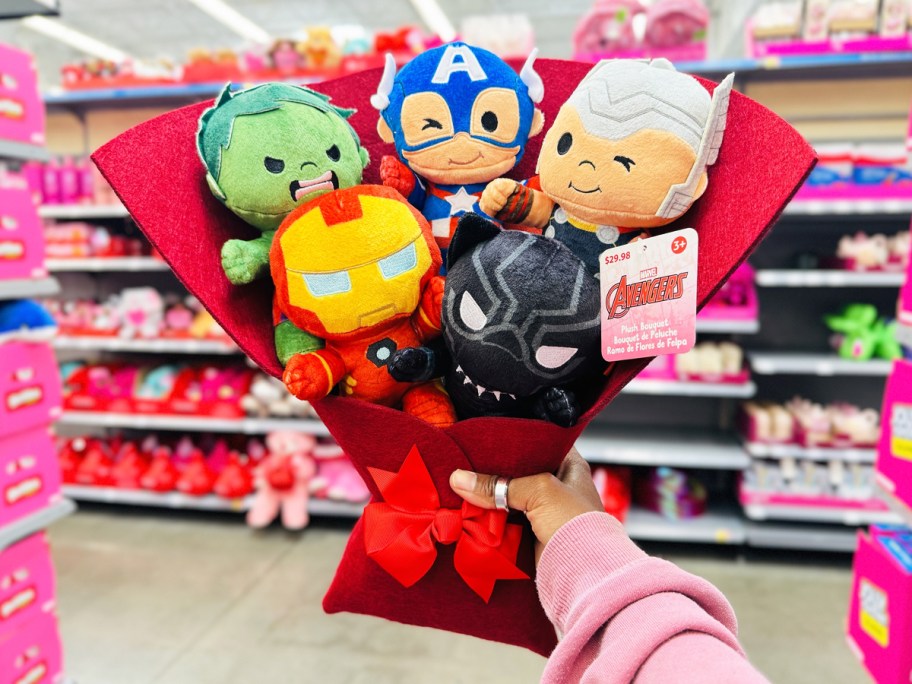 hand holding up Marvel Avengers 16" Plush Valentine's Bouquet in store