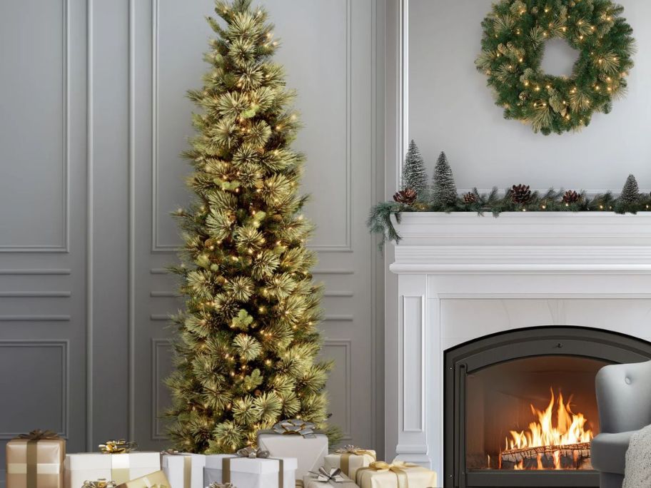 A tall and thin Christmas tree in a living room