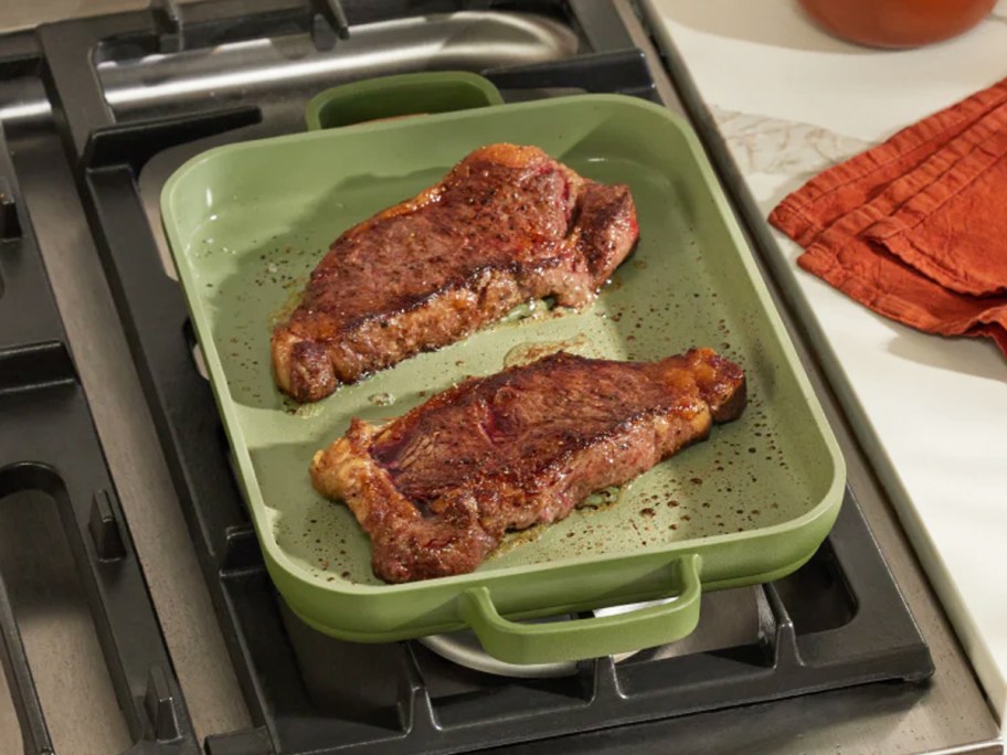 cooking steaks in a griddle pan