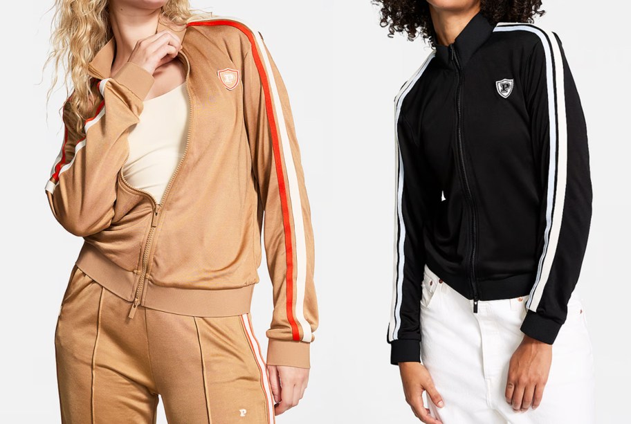 two women in tan and black track jackets