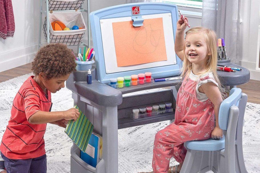 kids playing with Step2 Studio Art Desk