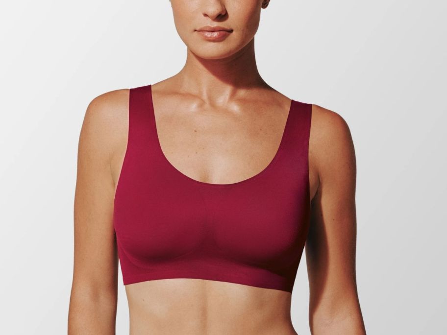 A woman wearing a red sports bra