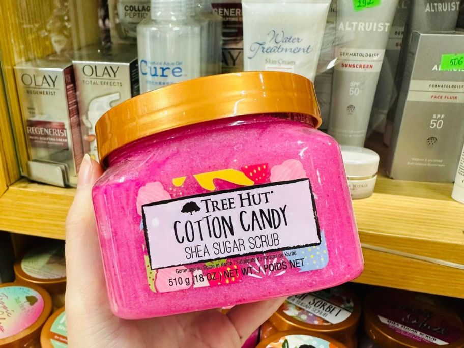 hand holding Tree Hut Cotton Candy Shea Sugar Scrub in store