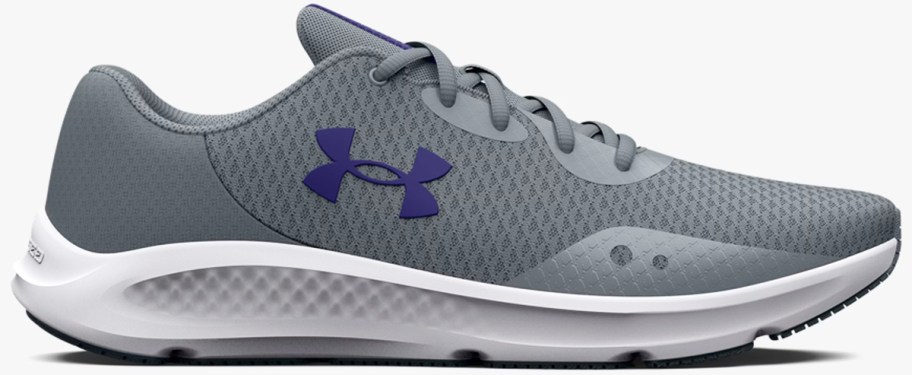 grey running shoe with blue under armour logo