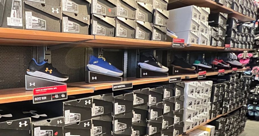 A wall of Under Armour Shoes and shoeboxes