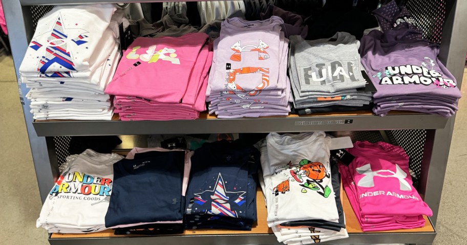 display rack of kids under armour graphic tees