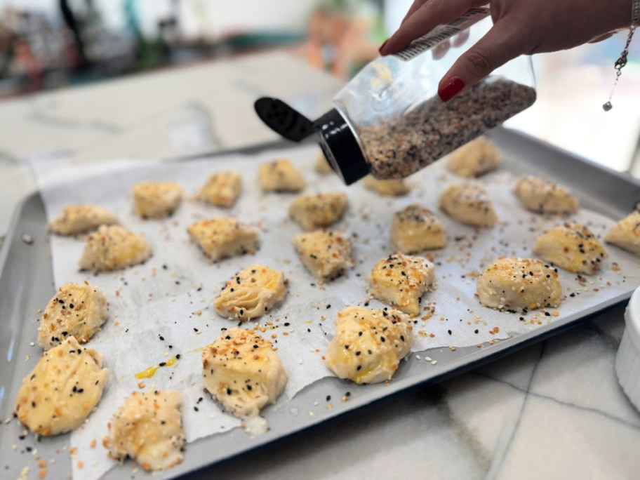 adding everything bagel seasoning to pretzel bites 