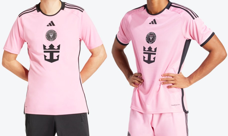 two men in pink and black soccer jerseys