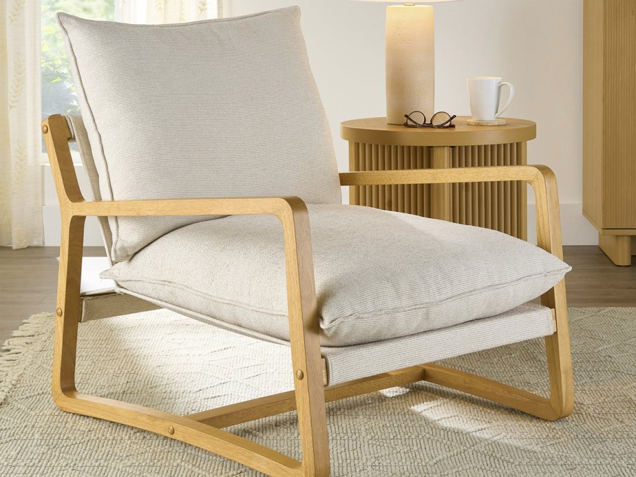 beige and wooden sling chair in living room 