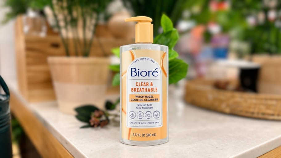 a bottle of biore facial cleanser on a tabletop in a store