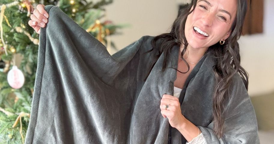 woman wearing grey heated blanket