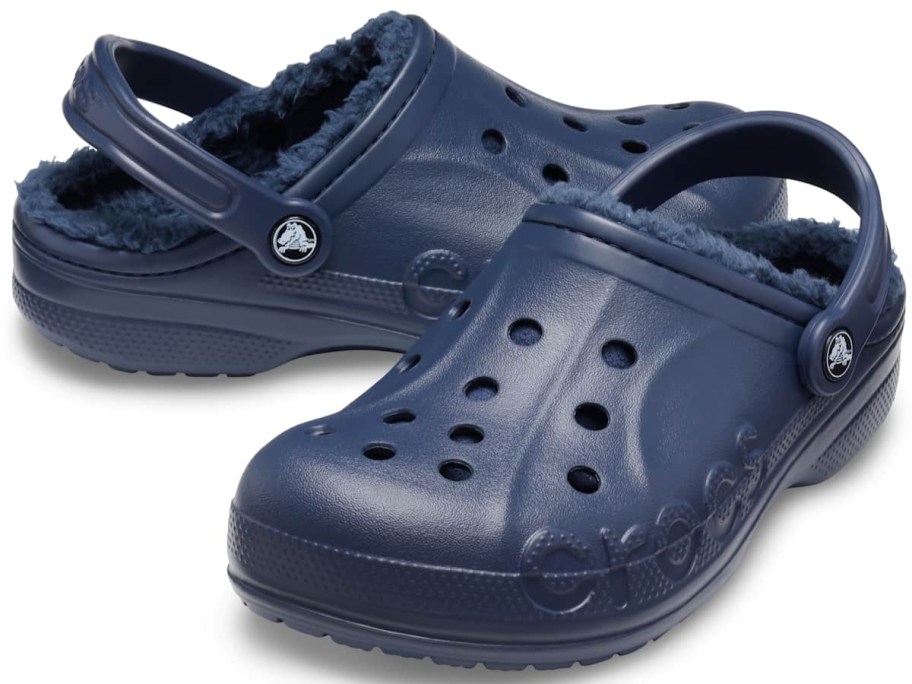 a pair of navy blue lined Crocs clog shoes