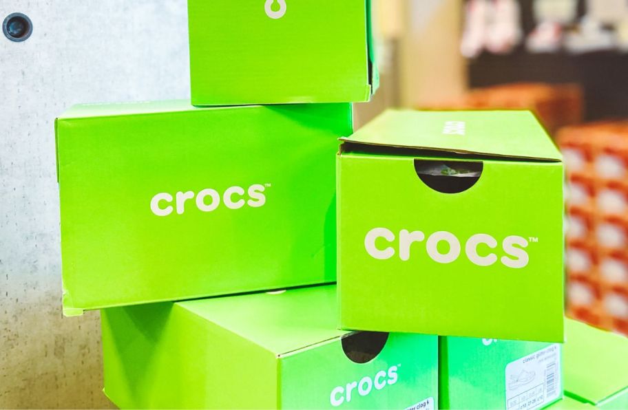 a stack of crocs shoe boxes