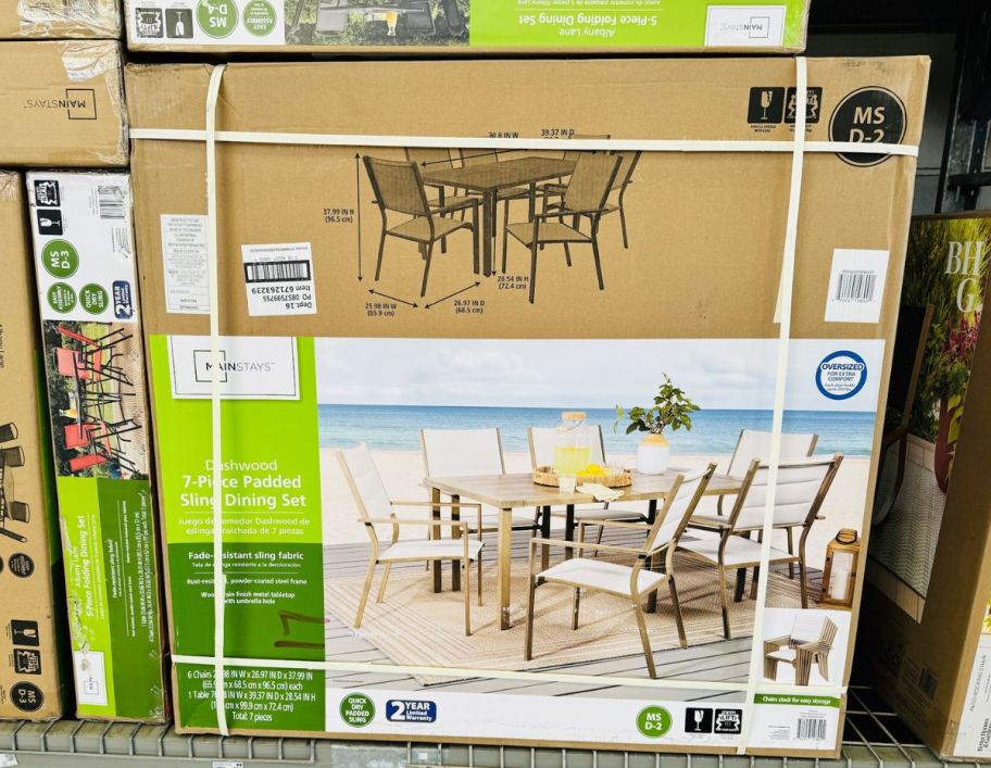 7 piece patio dining set in a box on a store shelf