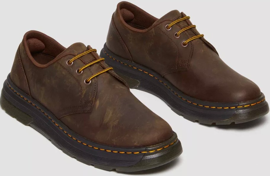 pair of brown dr martens shoes