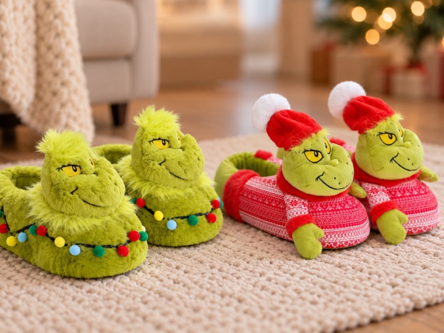 2 pairs of Grinch slippers on beige rug