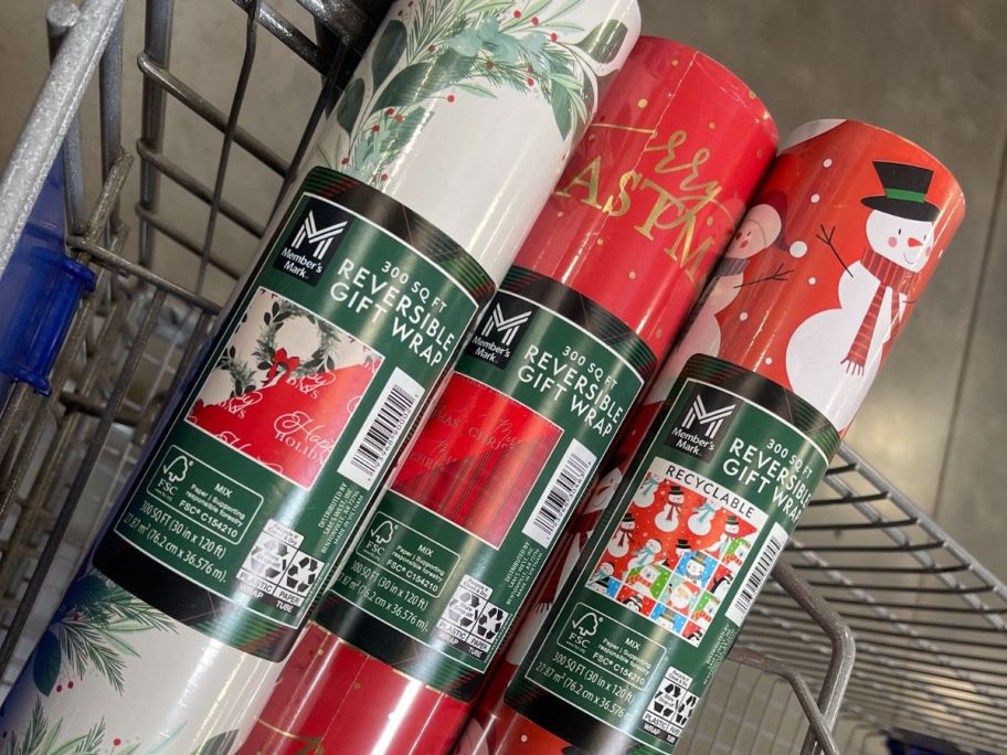 three gift wrap rolls in cart in store