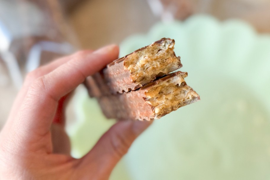 hand holding nutty buddy bars cut in half