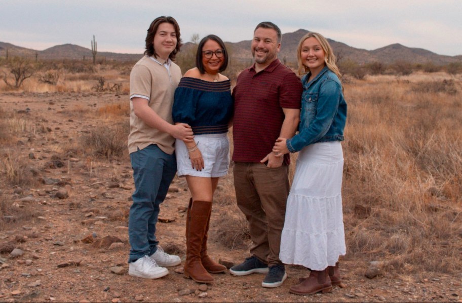 Coordinating family with two teenage kids standing in desert