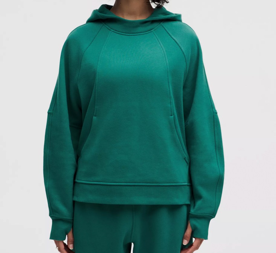 woman in green hoodie