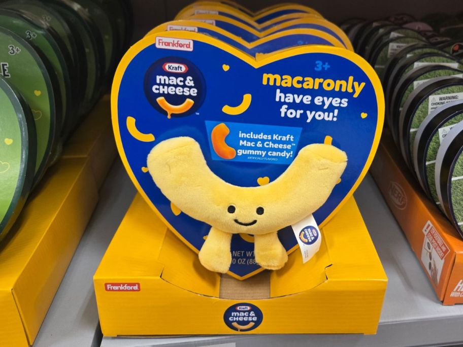 a womans hand holding a mac n cheese valentines plush gift