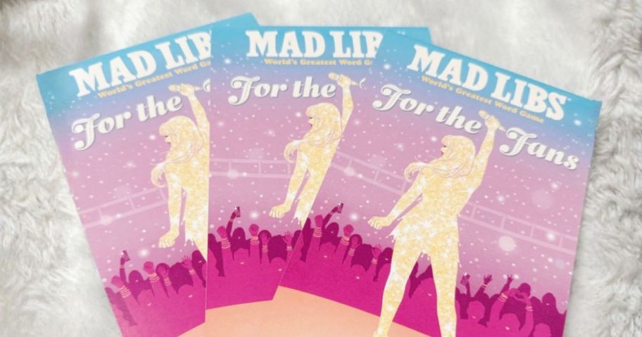 three Mad Libs: Taylor Swift Edition books on blanket