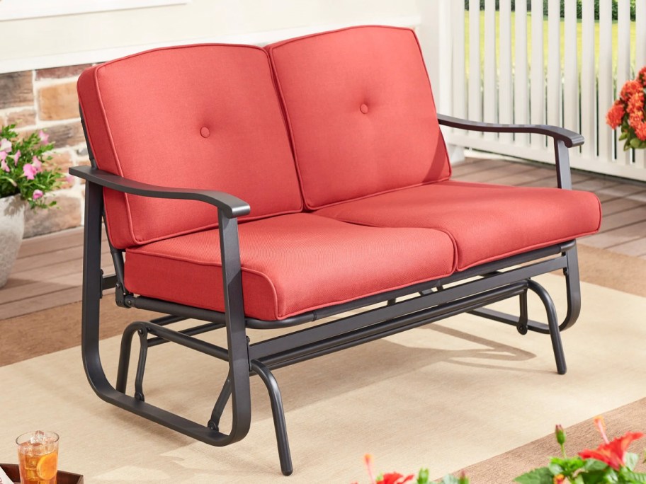 red gliding bench on lanai