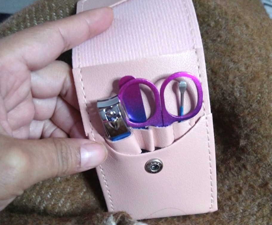 hand holding manicure set