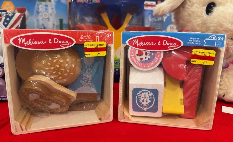 two melissa and doug toys on a store shelf