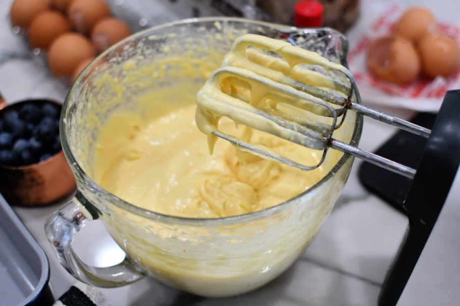 mixing a yellow cake mix to make crumb cake