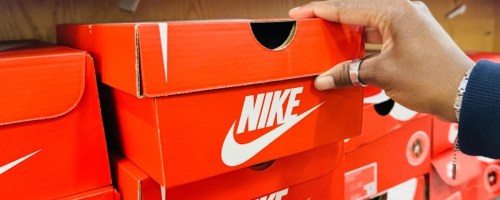 hand holding nike shoe box