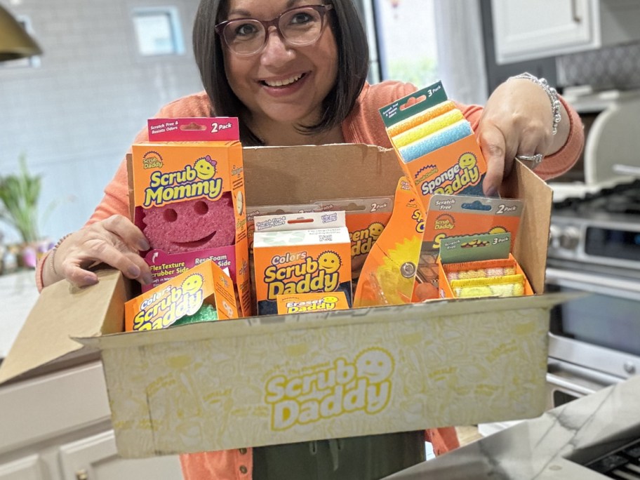 woman hlding scrub daddy gift box