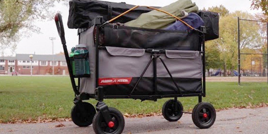 gray radio flyer wagon on sidewalk full of chairs