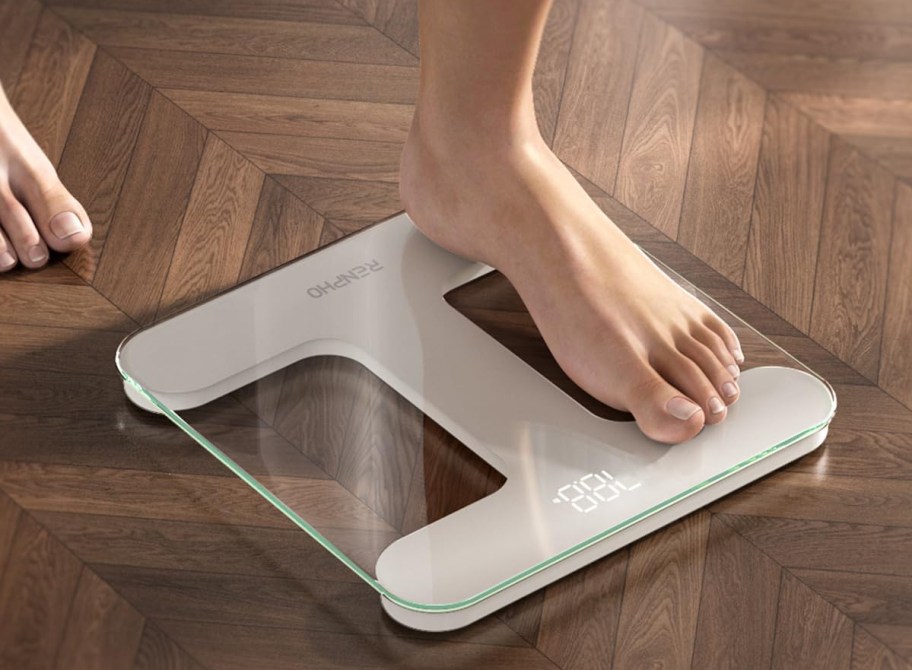 person standing on a digital scale