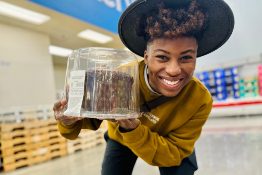 Cam holding a huge cupcake
