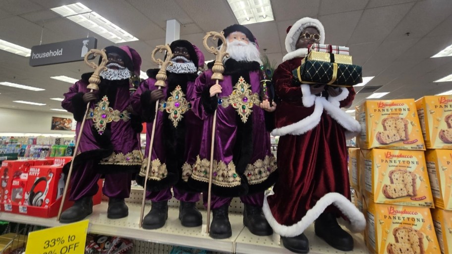 assorted santa figures on store shelf