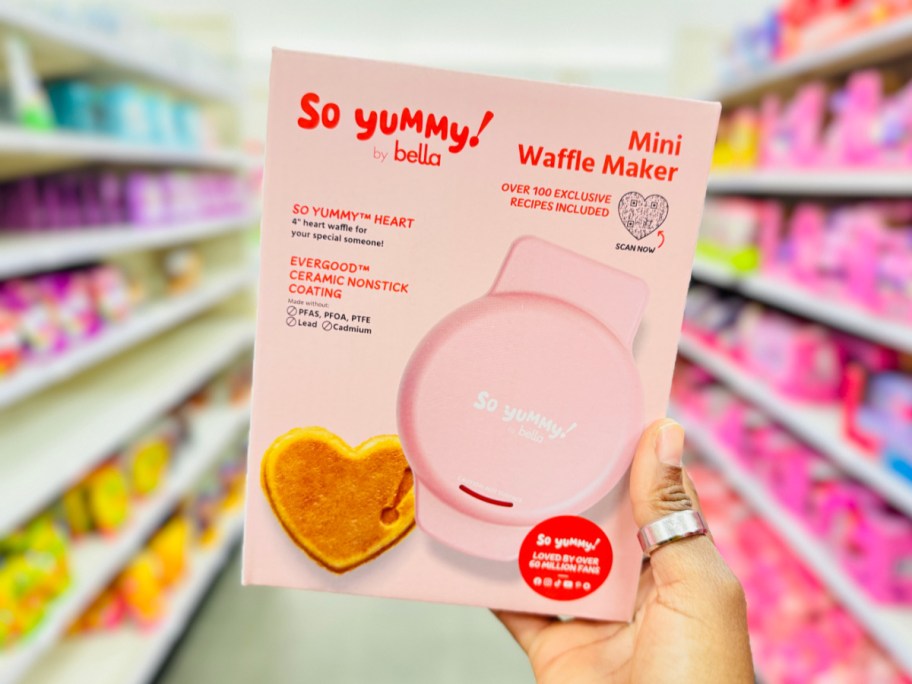 hand holding mini waffle maker in box