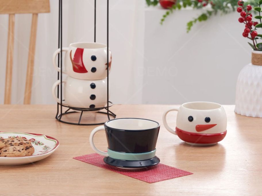 snowman stackable mugs on table