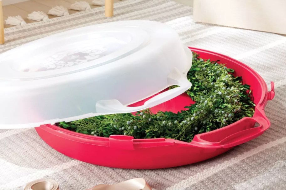 wreath inside round box with red bottom