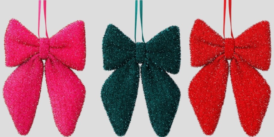 3 tinsel bow ornaments in pink, green and red