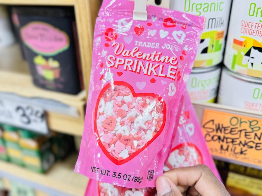 hand holding bag of valentines sprinkles 