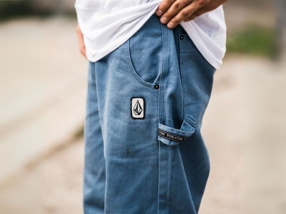 man wearing volcom pants