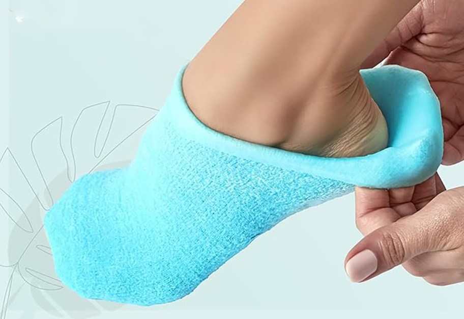 woman putting on a gel sock