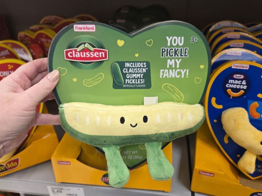 a womans hand holding a pickle valentines plush gift